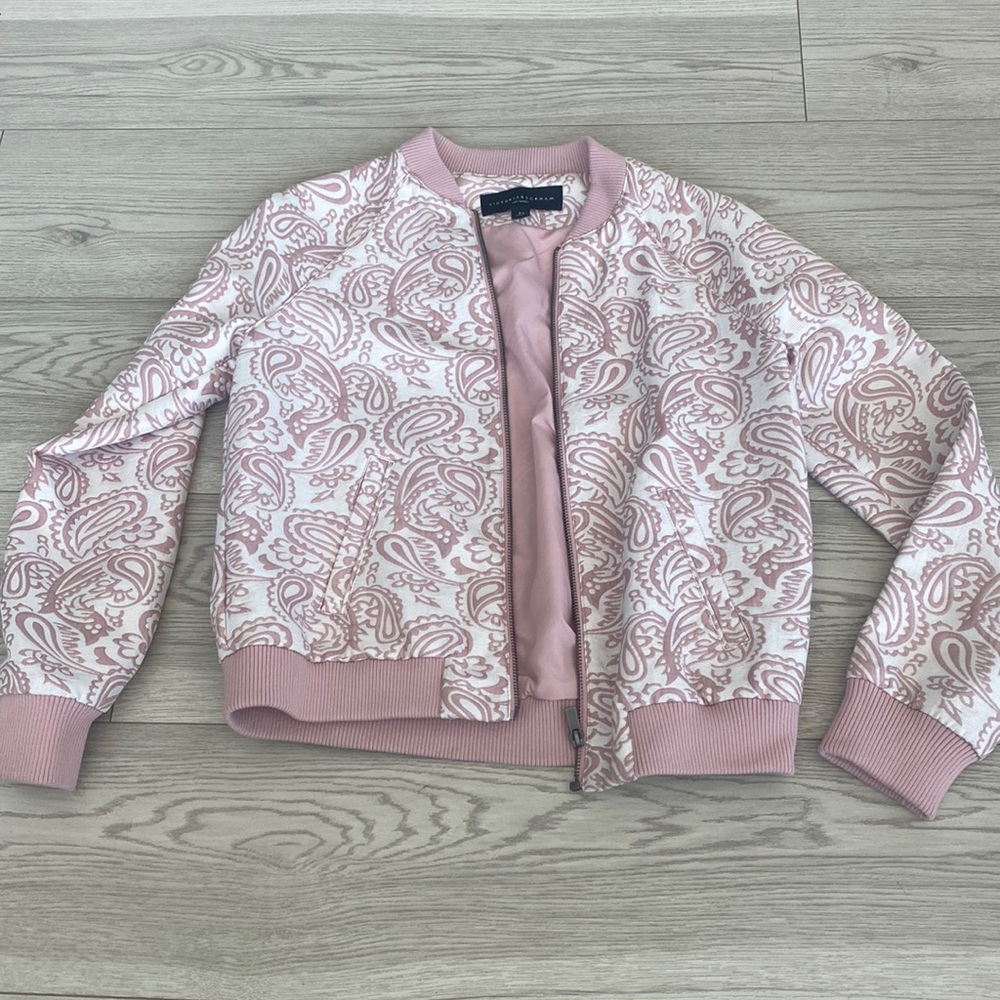 pink and white patterned bomber jacket with zipper